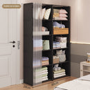Black storage cabinet with clothes and items in a bedroom setting