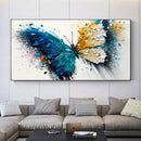 Abstract butterfly painting on a wall above a sofa