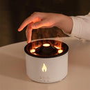 Hand interacting with a small flameless candle-like device on a neutral background