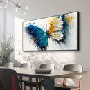 Dining room with a large abstract butterfly painting on the wall.