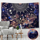 Decorative tapestry with celestial design in a room with a chair and small table.