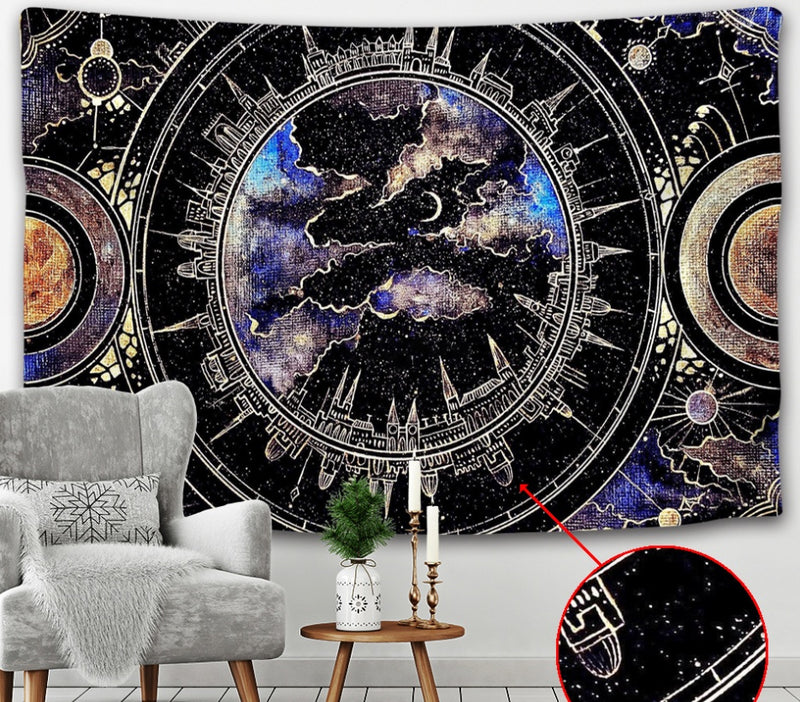 Decorative wall tapestry with celestial design in a room with a chair and small table.