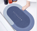 Mat, comforters, Blue bathmat with 'Bathroom' text on a white surface