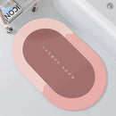 Mat, comforters, Oval-shaped bathmat with 'SHOWER ROOM' text on a bathroom floor.