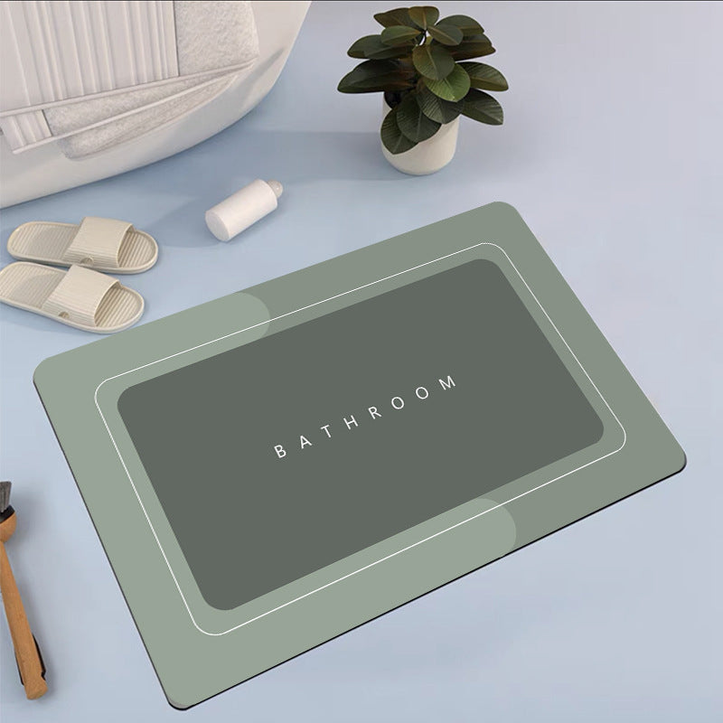 Mat, comforters, Rectangular bathmat with 'Bathroom' text on a light blue surface, surrounded by bathroom items.