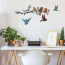 Home decor, room decor, wall decor, Decorative wall art of birds on a branch above a desk with plants and a typewriter.