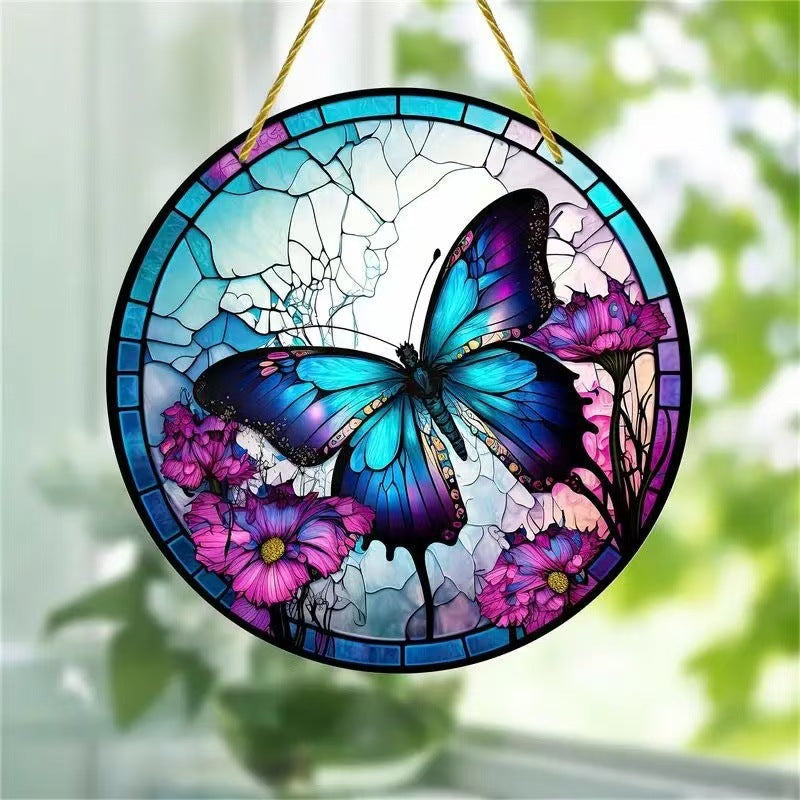 Home decor, room decor, wall decor, Stained glass window hanging with a butterfly and floral design, hanging outdoors.
