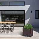 Garden pots, outdoor decor, garden ornaments, Outdoor patio area with a wooden table, stools, and a planter with greenery.