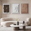 Home decor, room decor, wall decor, A set of three abstract geometric hanging paintings in varying shades of brown and white, displayed above a beige sofa with a modern decor setup.
