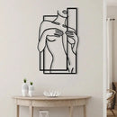 Home decor, room decor, wall decor, Abstract wall art of a woman holding a mirror with hands on a white wall above a wooden table.