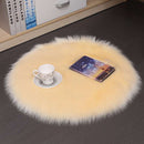 Mats, bed sheets, comforters, round beige rug with a cup and book on a dark floor