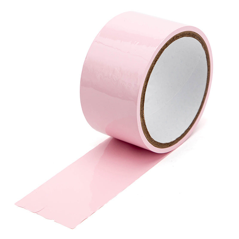 Household supplies, household cleaning products, cleaning products Roll of pink tape on a white background