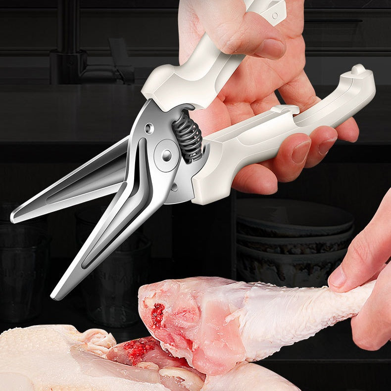 Household supplies, household cleaning products, cleaning products Person using poultry shears to cut a chicken leg on a black background