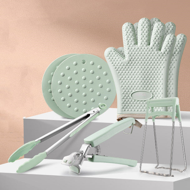 Household supplies, household cleaning products, cleaning products Set of green kitchen tools including a clip, gloves, and a chair on a light background