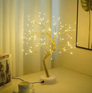 Home decor, room decor, Decorative LED tree on a table with a cup and saucer in a room setting.