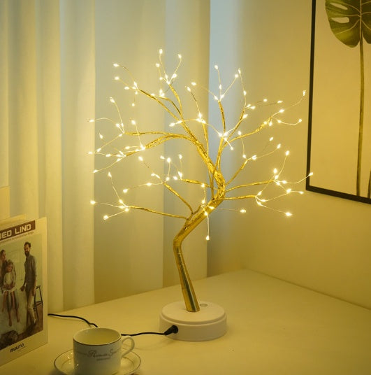 Home decor, room decor, Decorative LED tree on a table with a cup and saucer in a room setting.