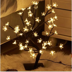 Home, decor, room decor, Decorative LED tree with lights on a bed