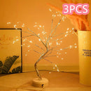 Home decor, room decor, Decorative LED tree with lights on a wooden surface, next to a container labelled '3PCS'.