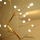 Home decor, room decor, Decorative gold branch with white lights against a beige background