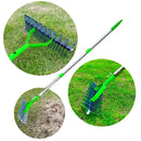 Garden pots, outdoor decor, garden ornaments, Garden rake with green handles and metal teeth on grass