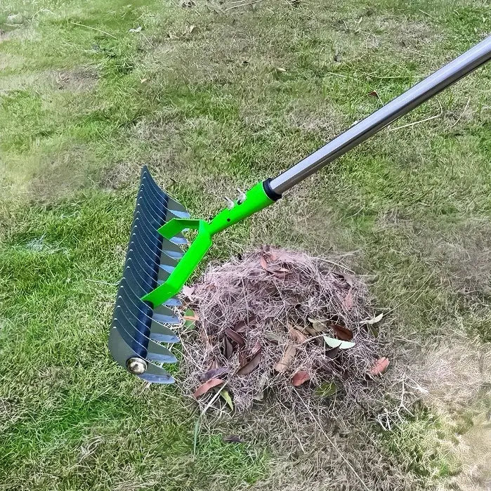 Garden pots, outdoor decor, garden ornaments, Green garden rake collecting leaves on a grassy area