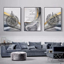 Home decor, wall decor, room decor, Three framed artworks with Arabic calligraphy and text on a wall above a grey sofa.