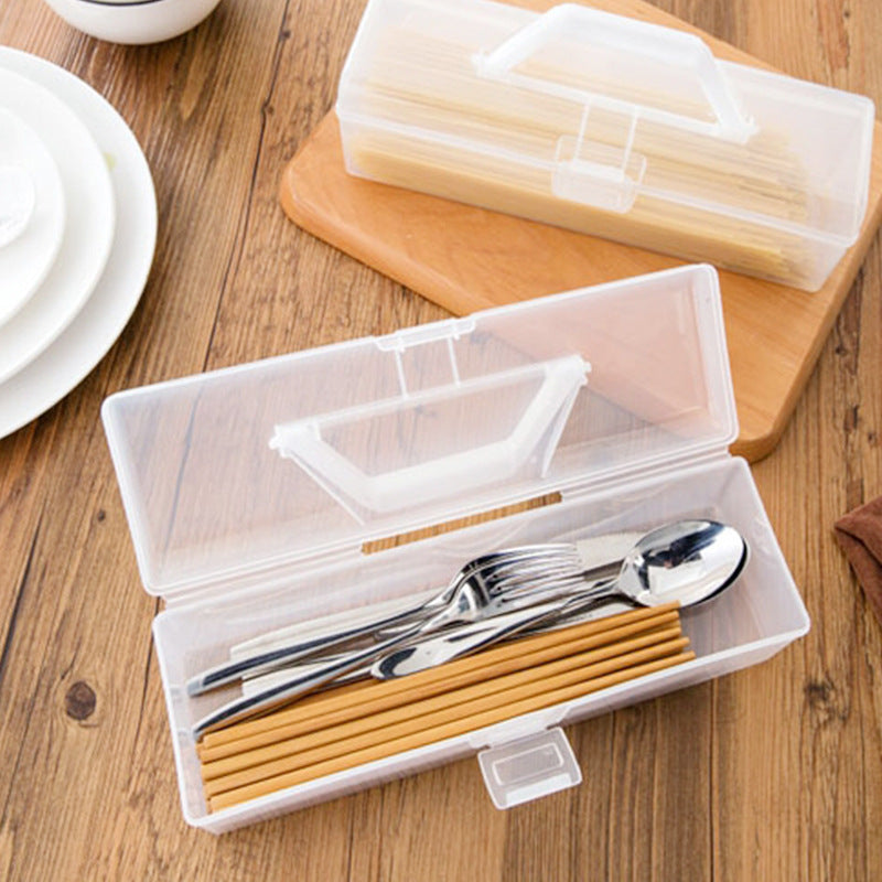 Household supplies, household cleaning products, cleaning products Set of silver cutlery in a transparent case on a wooden surface