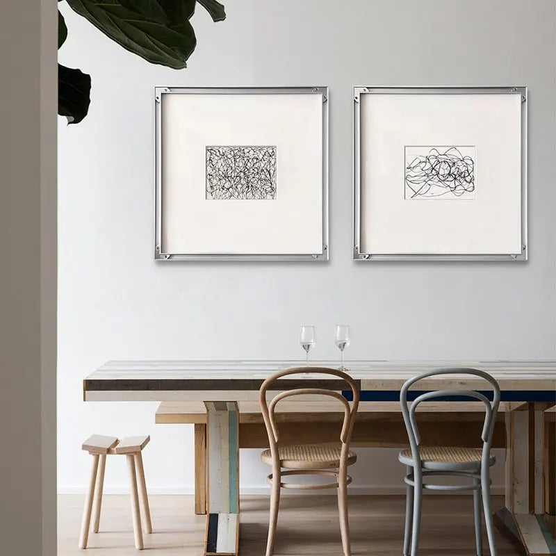 Home decor, wall decor, room decor, Dining room with a table, chairs, and abstract art on the wall.