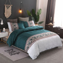Mat, bed sheets, comforters, Teal and white bedding set on a bed in a bedroom with decorative elements.