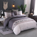 Mat, bed sheets, comforters, Bedroom with grey bedding set, decorative pillows, and a 'Enjoy Little Things' rug.