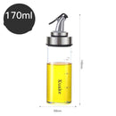 Household supplies, household cleaning products, cleaning products Glass oil bottle with a metal nozzle labelled 'Kuaka' containing yellow liquid, with measurements and '170ml' label.