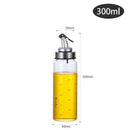 Household supplies, household cleaning products, cleaning products Glass oil bottle with measurements and oil level indicator on a white background