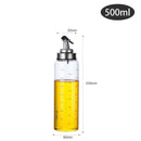 Household supplies, household cleaning products, cleaning products Glass oil bottle with measurement markings and a spray nozzle, filled with oil.