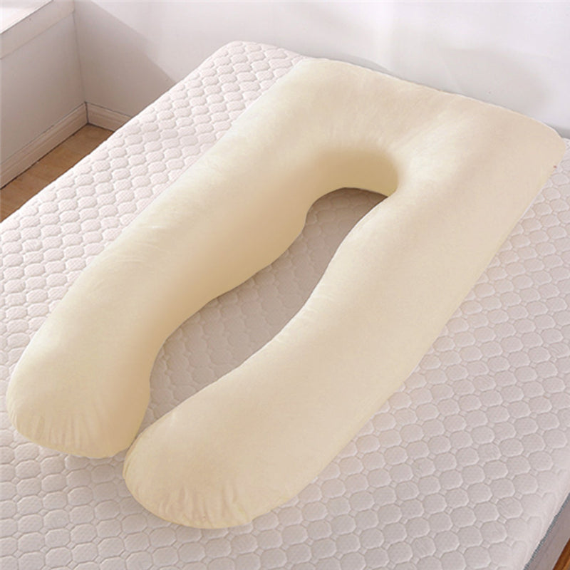 Comforters, bed sheets, mats, Beige U-shaped pillow on a textured surface