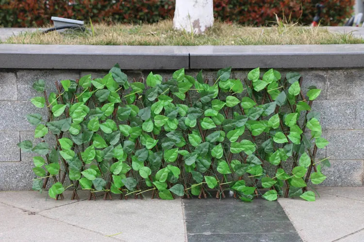 Garden pots, outdoor decor, garden ornaments, Artificial green leaf panel against a stone wall