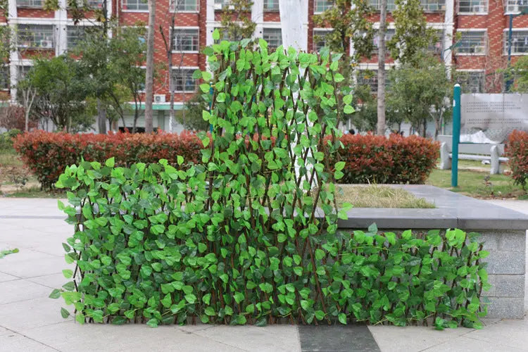 Garden pots, outdoor decor, garden ornaments, Artificial green screen panel in a park setting with buildings in the background
