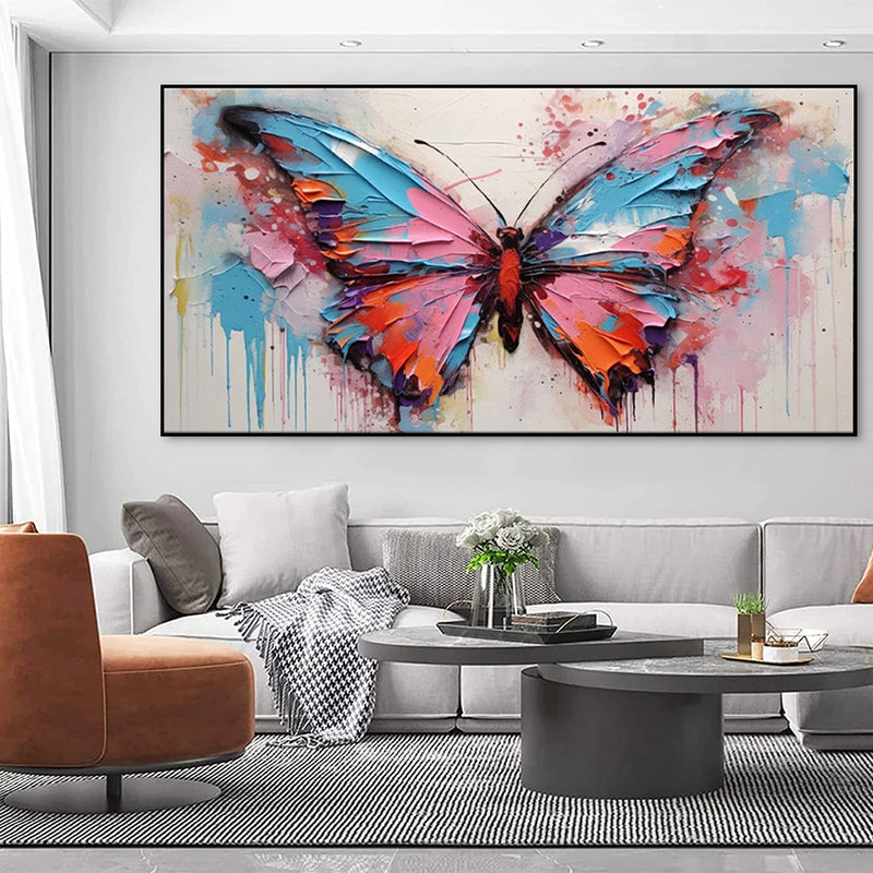 Living room with a large abstract butterfly painting on the wall.