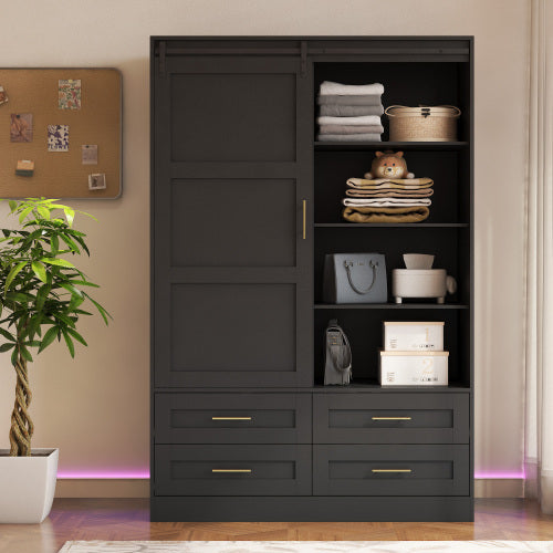 Black wardrobe with shelves and drawers in a room setting