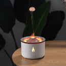 White decorative lantern with flame effect on a wooden surface