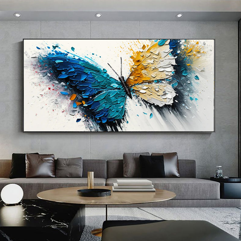 Modern living room with a large abstract butterfly painting on the wall.