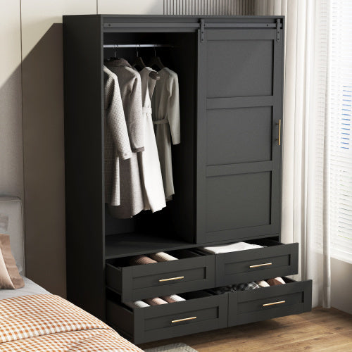 Black wardrobe with clothes and shoes in a bedroom setting